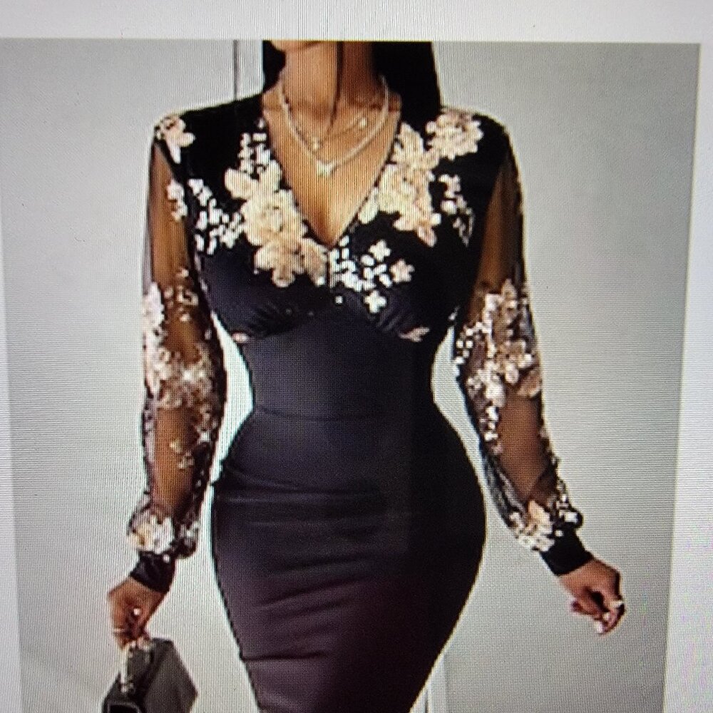 Shapely black dress with gold sequenced applics